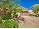 Inviting home with a well-maintained front yard, gravel, and a walkway leading to the front door at 11772 E Clinton St, Scottsdale, AZ 85259