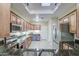 Spacious kitchen, stainless steel appliances, granite countertops, and convenient access to surrounding rooms at 11772 E Clinton St, Scottsdale, AZ 85259