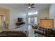 Spacious living room with leather furniture, tile flooring, and access to the patio through glass doors at 11772 E Clinton St, Scottsdale, AZ 85259