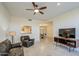 Inviting living room with open floorplan, featuring tile floors and comfortable leather seating at 11772 E Clinton St, Scottsdale, AZ 85259