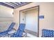 Outdoor shower stall with nearby lounge seating for rinsing off after a swim at 11772 E Clinton St, Scottsdale, AZ 85259