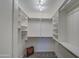 Spacious walk-in closet with custom shelving, ample storage space, and overhead lighting at 11772 E Clinton St, Scottsdale, AZ 85259