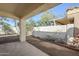 Covered patio with dirt landscaping and block fence at 11840 N 40Th Way, Phoenix, AZ 85028