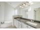 Bathroom featuring a large tub, double sinks, and lots of mirror space at 11840 N 40Th Way, Phoenix, AZ 85028
