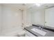 Bathroom with updated vanity, shower-tub combination, and large mirror at 11840 N 40Th Way, Phoenix, AZ 85028