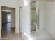 Bright bathroom featuring a shower with glass doors and tile floors at 11840 N 40Th Way, Phoenix, AZ 85028