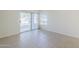 Bright bedroom with tile floor and a sliding door to the outside at 11840 N 40Th Way, Phoenix, AZ 85028
