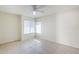 Bedroom with tile flooring, a window, and a ceiling fan at 11840 N 40Th Way, Phoenix, AZ 85028