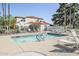 Community pool with chairs and umbrellas for relaxing at 11840 N 40Th Way, Phoenix, AZ 85028