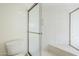 Bright bathroom featuring a shower with glass doors and a tile bench at 11840 N 40Th Way, Phoenix, AZ 85028