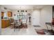 Inviting dining area featuring a glass table, stylish chairs, and bright window at 12212 N Paradise Village S Pkwy # 146, Phoenix, AZ 85032