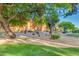 Desert landscape with walking path and grass on community grounds offers a tranquil retreat at 12212 N Paradise Village S Pkwy # 146, Phoenix, AZ 85032