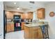 Efficient kitchen features stainless steel appliances, ample counter space, and classic wooden cabinetry at 12212 N Paradise Village S Pkwy # 146, Phoenix, AZ 85032