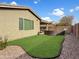 Well-maintained backyard with artificial turf, perfect for low-maintenance outdoor enjoyment at 12227 W Prickly Pear Trl, Peoria, AZ 85383