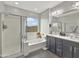 Bright bathroom with a soaking tub, glass-enclosed shower, and double vanity at 12227 W Prickly Pear Trl, Peoria, AZ 85383