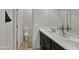 This bathroom features double sinks with a shared mirror and black cabinetry at 12227 W Prickly Pear Trl, Peoria, AZ 85383