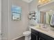 Stylish half bathroom featuring modern fixtures, white countertops and shelving with decorative accents at 12227 W Prickly Pear Trl, Peoria, AZ 85383