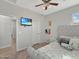 This bedroom features a plush bed with a padded headboard and a flat-screen TV at 12227 W Prickly Pear Trl, Peoria, AZ 85383