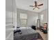 This bedroom features neutral walls, wood-look floors, and a ceiling fan at 12227 W Prickly Pear Trl, Peoria, AZ 85383