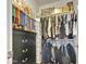Walk-in closet features organizers, shelving, and hanging rods at 12227 W Prickly Pear Trl, Peoria, AZ 85383