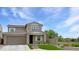 Charming two-story home with a well-manicured front yard and attached two-car garage, situated on a sunny lot at 12227 W Prickly Pear Trl, Peoria, AZ 85383
