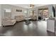 Bright living room with hardwood floors, neutral furniture, and sliding door to patio at 12227 W Prickly Pear Trl, Peoria, AZ 85383