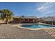 Beautiful backyard featuring pool, solar panels, drought resistant landscaping, and covered patio at 1226 N Nevada Way, Mesa, AZ 85203