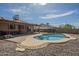 Resort-style backyard with sparkling pool, solar panels, and covered patio at 1226 N Nevada Way, Mesa, AZ 85203
