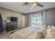 Bedroom with ceiling fan and sliding glass doors that provide access to the outdoor area at 1226 N Nevada Way, Mesa, AZ 85203