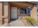 Inviting front entrance with security door, welcome mat, and desert landscaping at 1226 N Nevada Way, Mesa, AZ 85203