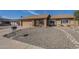 Charming single-story home with a low-maintenance front yard and a two-car garage at 1226 N Nevada Way, Mesa, AZ 85203