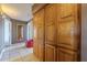 Hallway featuring built-in wooden cabinets and neutral-toned walls and tile flooring at 1226 N Nevada Way, Mesa, AZ 85203