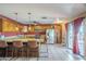 Kitchen with stainless steel appliances, granite counters, breakfast bar and easy access to the dining area at 1226 N Nevada Way, Mesa, AZ 85203