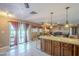 Spacious kitchen featuring an island and a seamless flow to the dining and outdoor areas at 1226 N Nevada Way, Mesa, AZ 85203