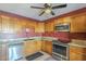 Bright kitchen featuring stainless steel appliances, tile flooring, and ample cabinet storage at 1226 N Nevada Way, Mesa, AZ 85203