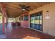 Relaxing covered patio with outdoor seating, ceiling fans, and yard access at 1226 N Nevada Way, Mesa, AZ 85203