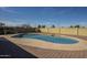 Backyard featuring a sparkling swimming pool surrounded by a brick paver patio at 1226 N Nevada Way, Mesa, AZ 85203