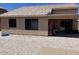 Large backyard with desert landscaping and covered patio at 12565 W Amelia Ave, Avondale, AZ 85392
