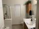 Functional bathroom featuring a shower with glass door, vanity with good storage space at 12565 W Amelia Ave, Avondale, AZ 85392