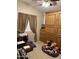 Cozy bedroom with a large wardrobe and lots of stuffed animals at 12565 W Amelia Ave, Avondale, AZ 85392