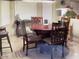 Inviting dining area featuring a wooden table with chairs, perfect for Gathering meals at 12565 W Amelia Ave, Avondale, AZ 85392