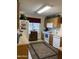 Functional kitchen with wooden cabinetry, white appliances, and a bright, airy atmosphere at 12565 W Amelia Ave, Avondale, AZ 85392