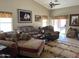 Cozy living room featuring plush seating, area rug, and unique equestrian-themed decor at 12565 W Amelia Ave, Avondale, AZ 85392