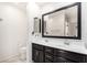 Bright bathroom features a double sink vanity, ample counter space, and a large mirror at 12673 W Myrtle Ave, Glendale, AZ 85307