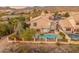 Aerial view of a home with a refreshing pool and mountain views in backyard at 12809 E Sahuaro Dr, Scottsdale, AZ 85259