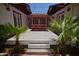 Inviting backyard deck with string lights and mature landscaping creating a private outdoor space at 1301 E Sheridan St, Phoenix, AZ 85006