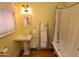 Bathroom featuring classic fixtures, a pedestal sink and a clawfoot tub and shower at 1301 E Sheridan St, Phoenix, AZ 85006