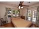 Bedroom with a queen sized bed, ceiling fan, windows and french doors at 1301 E Sheridan St, Phoenix, AZ 85006
