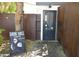 Rustic coffee shop entrance with a chalkboard sign, string lights, and a weathered metal facade, inviting a cozy atmosphere at 1301 E Sheridan St, Phoenix, AZ 85006