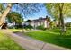 Charming two-story home with a well-manicured lawn and mature shade trees, creating curb appeal at 1301 E Sheridan St, Phoenix, AZ 85006